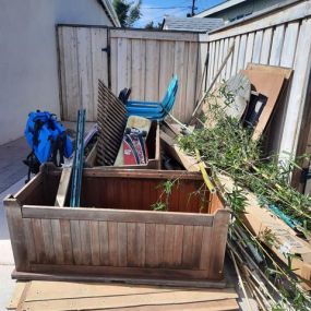 A before photo from a junk removal job in Clairemont consisted of wood, old items around the house and some yard debris. Junk King San Diego Downtown hauls it all!