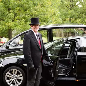 Miles & Daughters Funeral Directors vehicle and driver
