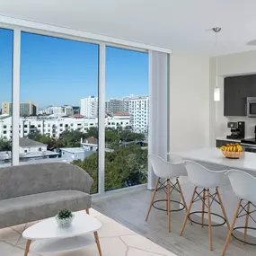 Open concept kitchen and living with floor to ceiling windows