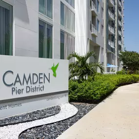 Monument sign outside community at Camden Pier District apartments in St. Petersburg, Florida.