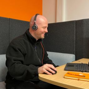 Air IT staff member working on a laptop