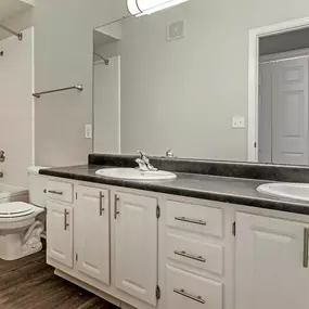 The bathroom at Cierra Crest Apartments features a relaxing bathtub for ultimate comfort.