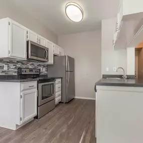 The kitchen at Cierra Crest Apartments features a modern island for added convenience and style.