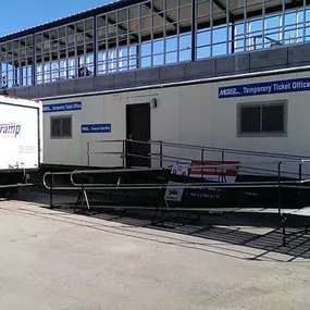 Amramp provides wheelchair access for the Mobile Mini trailer serving as the temporary ticket office at the Metra station in Joliet, IL during the multi-million dollar redevelopment project.