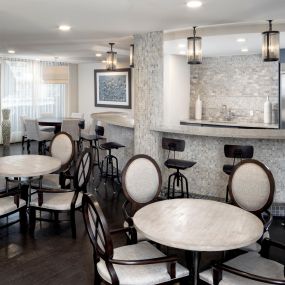 Resident lounge with dining and bar area.