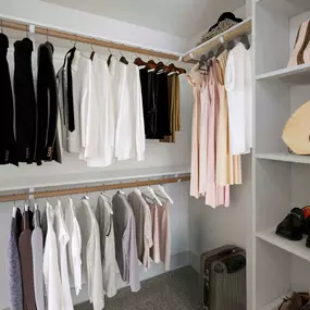 Spacious closet with shoe rack and wood shelving at Camden Boca Raton apartments in Boca Raton, Florida.