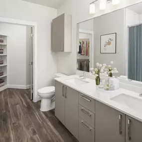 Luxury bathroom with walk-in closet and double-sink vanity at Camden Washingtonian in Gaithersburg, MD