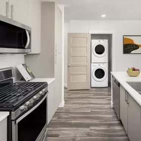 Kitchen at Camden Washingtonian apartments in Gaithersburg, MD features soft-close cabinetry and gas ranges