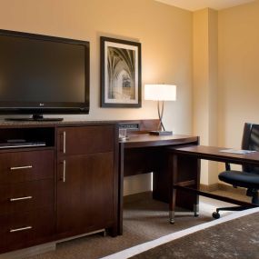 Enhanced work desk area in our New Haven Hotel guestrooms, including mini-fridge and laptop safe.