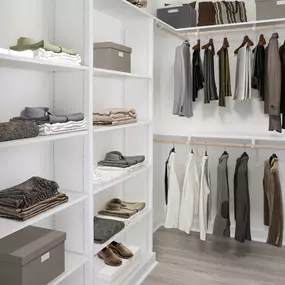 White contemporary apartment closet with built-in shelving at Camden Grandview in Charlotte, NC