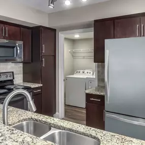 Kitchen with granite countertops and espresso cabinets