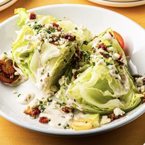 Fall 2022 Wedge salad with crispy bacon, point reyes blue, tomato, ranch