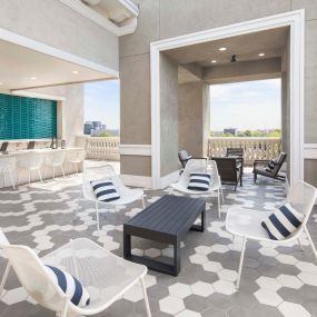Sky Lounge with Outdoor Kitchen in the Terrace Building at Camden Highland Village apartments and townhomes in Houston, Texas