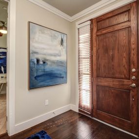 The townhomes entrance with wood flooring and den