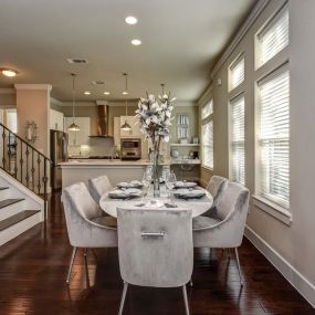 The townhomes dining room alongside staircase to upper floors