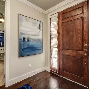 The townhomes entrance with wood flooring and den