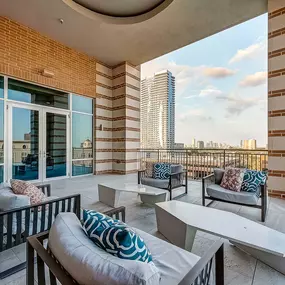 Rooftop outdoor lounge with seating and skyline views