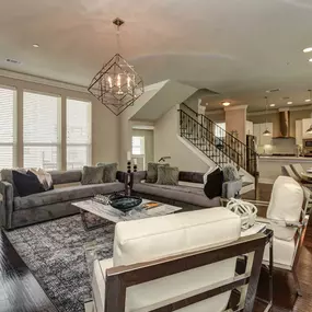 The townhomes open concept living dining kitchen with crown molding