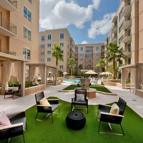 Poolside courtyard with seating and cabanas