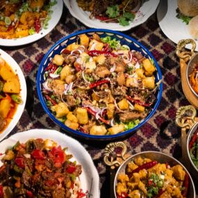 A group of Uyghur food on a table, Karamay, London