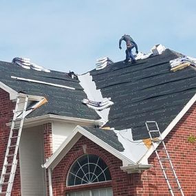 Springtree Restoration Roofing Team is in action on the work-in-progress project.