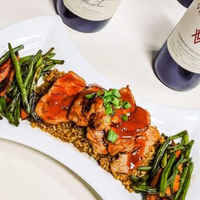 Sweet & savory barbecue pork tenderloin served over dirty rice & mixed veggies!