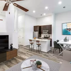 Open concept living with wood-look flooring throughout at Camden Monument Place apartments in Fairfax, VA
