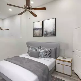 Bedroom with wood-look flooring and ceiling fan at Camden Monument Place apartments in Fairfax, VA