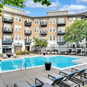 Resort-style pool with lounge chairs at Camden Monument Place apartments in Fairfax, VA