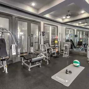 24-hour fitness center with strength training equipment at Camden Monument Place apartments in Fairfax, VA
