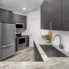 Kitchen with stainless steel appliances at Camden Monument Place apartments in Fairfax, VA