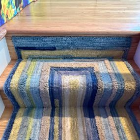 An ordinary rug turned into a stair runner.