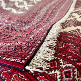 Securing fringe on an oriental rug.