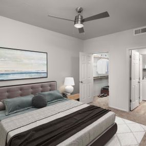 Bedroom with lighted ceiling fan, ensuite bathroom, and walk-in closet