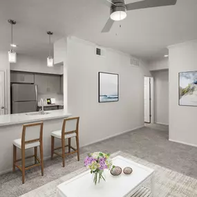 Open-concept living room near kitchen with room for barstool seating