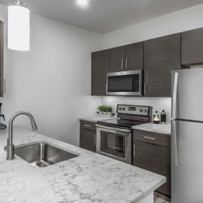 Modern garden apartment kitchen with stainless steel appliances
