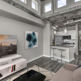 Contemporary midrise apartment living room with lofted ceilings