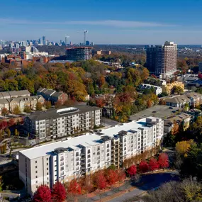 Aerial view of community with city skyline