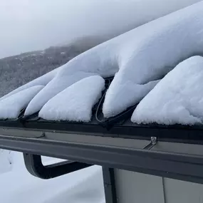 Heat Cables Melting Snow on a Roof In Winter