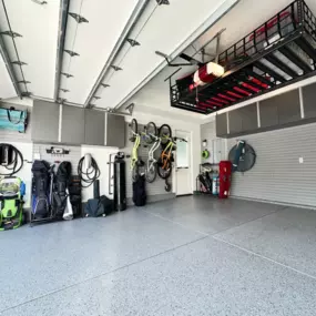 Spring Garage Makeover: Epoxy Floor, Overhead Storage & Custom Cabinets—So Good, the Neighbors Are Jealous Upgrade your garage with a complete garage organization system from PremierGarage of Southern Maine. This space features a sleek, high-performance epoxy garage floor in Smoke—durable, easy to c