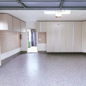 Garage Storage Inspiration | Custom Cabinets & Epoxy Flooring Ideas from PremierGarage of Southern Maine  Dreaming of a clean, organized garage? This sleek setup is exactly the kind of transformation we help homeowners achieve across Southern Maine. Featuring built-in garage cabinets, slatwall stora