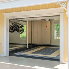 Upgrade Your Garage with PremierTrax Flooring, Custom Cabinets, and Overhead Storage  Transform your garage into an organized, high-performance space with PremierGarage of Southern Maine. This garage features our durable, slip-resistant PremierTrax™ garage floor tiles, stylish custom garage cabinets