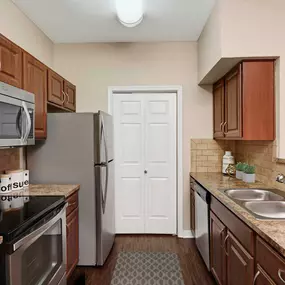 Kitchen with laminate countertops and glass cooktop