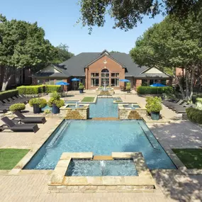 Aerial view of resort-style pool and sundeck at Camden Addison apartments in Addison, TX