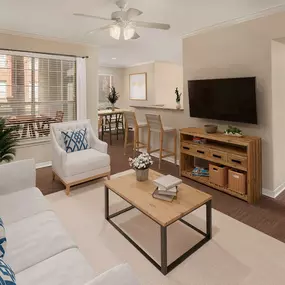 First floor living room with wood-style flooring at Camden Addison