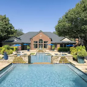 Resort-style pool top level with fountains at Camden Addison apartments in Addison, TX