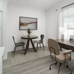 Dining area with work from home desk and bistro table seating at Camden Addison apartments in Addison, TX