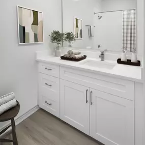 Bathroom with white quartz countertop and white shaker cabinets at Camden Addison apartments in Addison, TX
