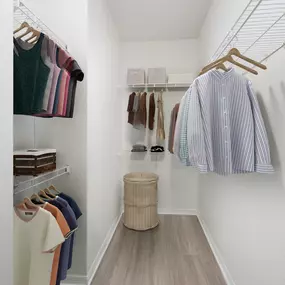 Closet with wood-style flooring and wire shelves at Camden Addison apartments in Addison, TX