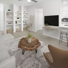 Open floor plan with built- in shelves and wood-style flooring throughout at Camden Addison apartments in Addison, TX